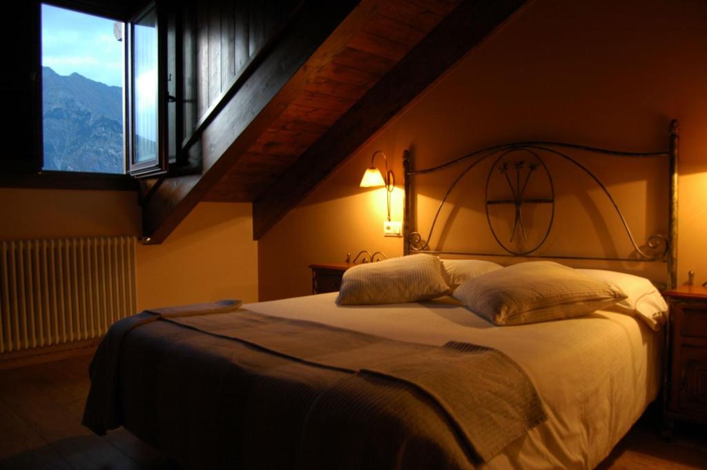 Postel nebo postele na pokoji v ubytování Hotel Areulo