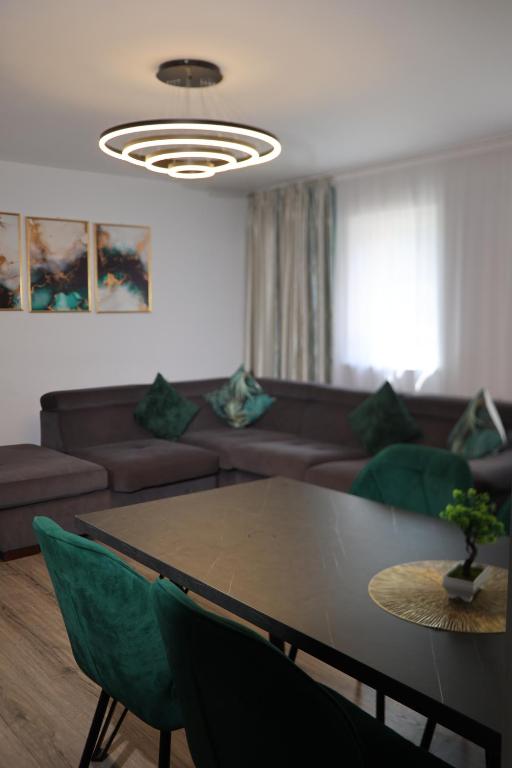 a living room with a couch and a table at Karlsburg Apartament in Alba Iulia