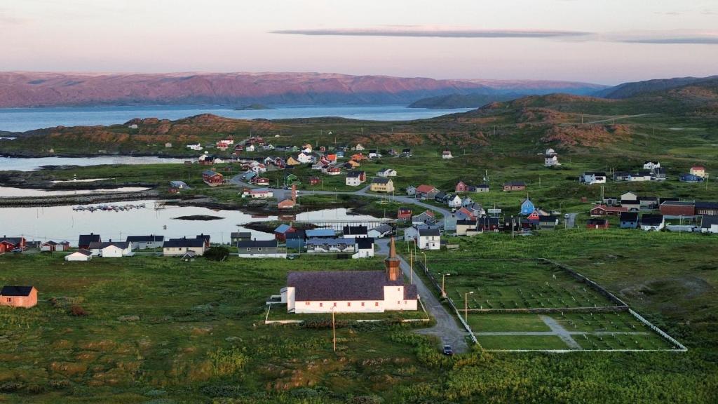 an aerial view of a small town on a hill at Gamvik brakkebo as in Gamvik