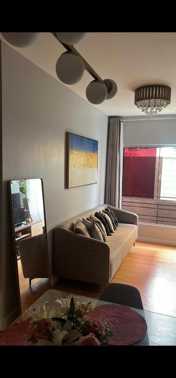 a living room with a couch and a table at Apartamento 2 Quartos , Ananindeua para C0P30 in Ananindeua