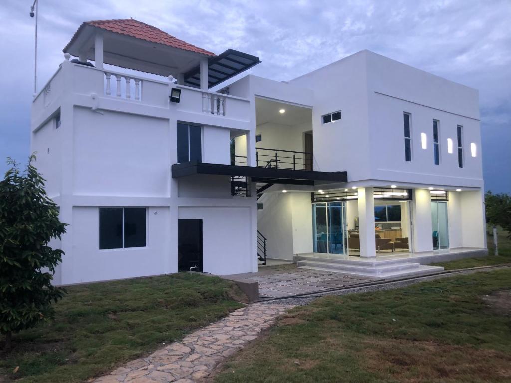 a white house with a view of it at Finca Villa Hayde in Flandes