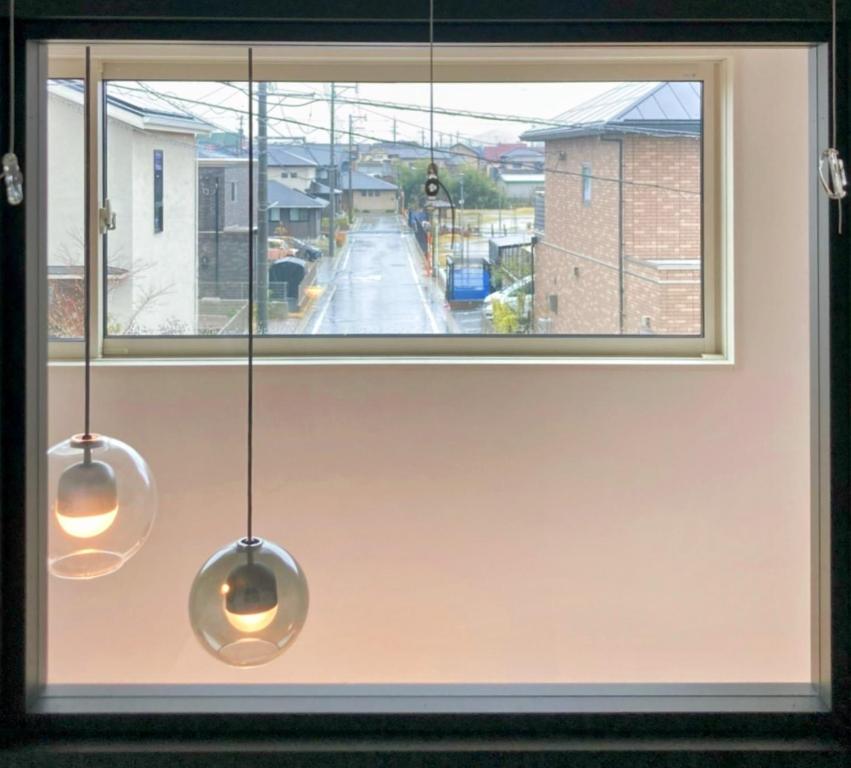a window with two lights hanging from it at Akikawa Villas1 - Vacation STAY 18834 in Yuge