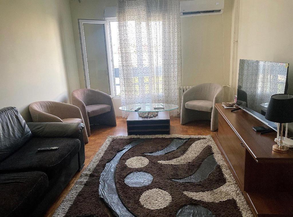 a living room with a couch and a table at Kutak 61 in Beograd