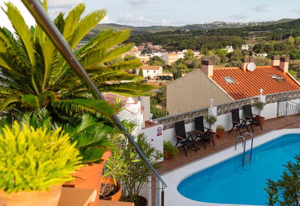 a view from the balcony of a villa with a swimming pool at Hotel Ridomar 365 in Lloret de Mar