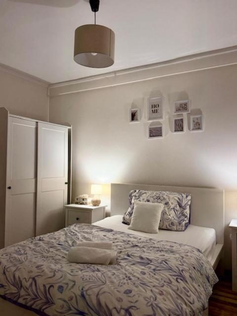 a bedroom with a bed with two pillows on it at Harmony Suite Apartment in Pápa