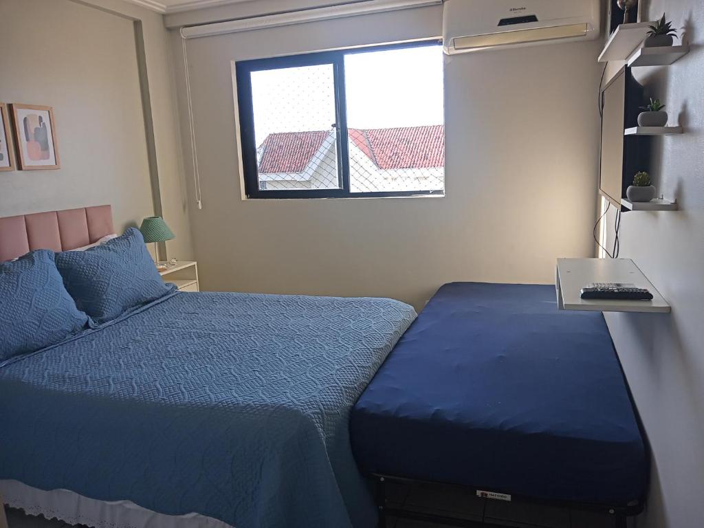 Postel nebo postele na pokoji v ubytování Apê Aconchego Calhau - Próximo à Praia Litorânea