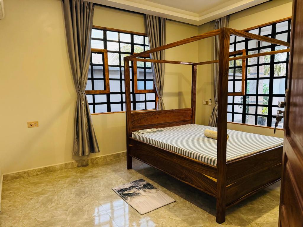 Katil atau katil-katil dalam bilik di Belyn Private Villa