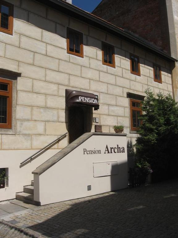 a building with a entrance to a tunnel at Pension Archa in Znojmo