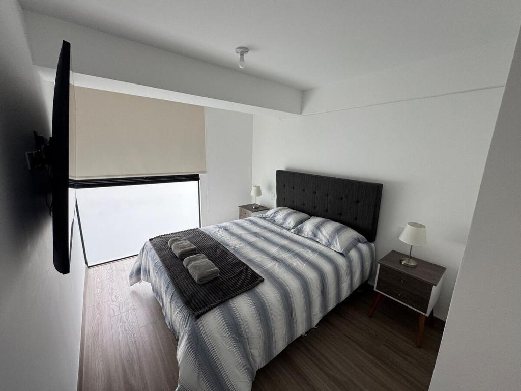 Ένα ή περισσότερα κρεβάτια σε δωμάτιο στο Premium apartment in Miraflores with rooftop pool