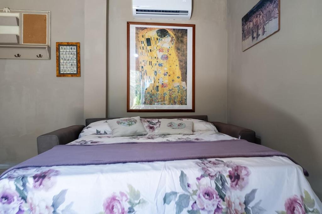 Ένα ή περισσότερα κρεβάτια σε δωμάτιο στο Il Nido in Toscana casa vacanze