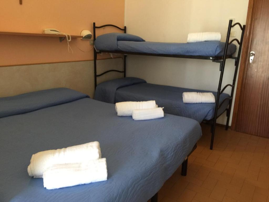 Postel nebo postele na pokoji v ubytování Hotel Bacco