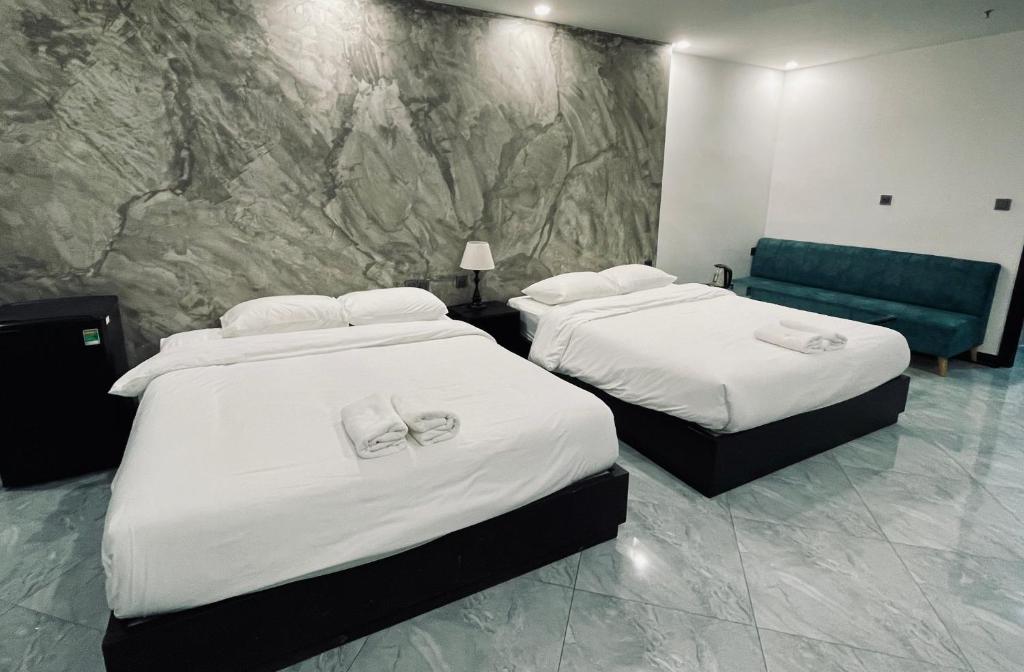 Giường trong phòng chung tại Ben Ben Hotel - Near City Center - Budget Stay