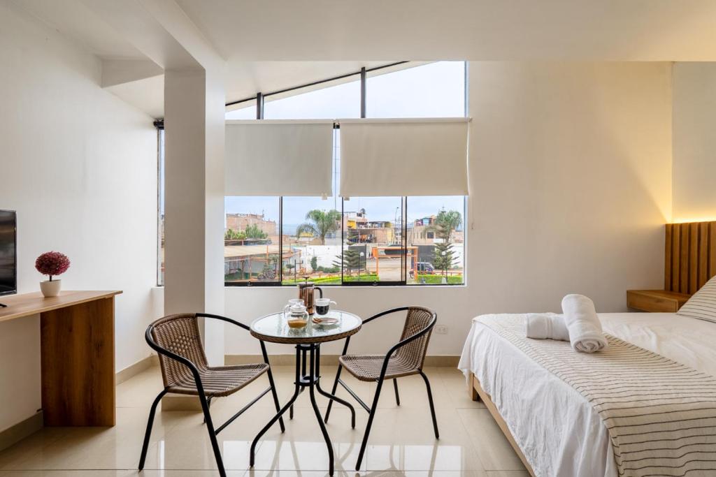 Ένα ή περισσότερα κρεβάτια σε δωμάτιο στο Huaral House