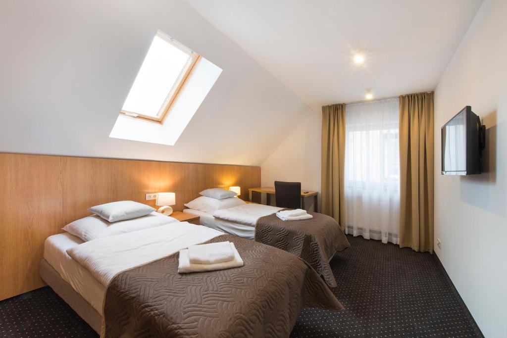 Posteľ alebo postele v izbe v ubytovaní Apartamenty Turek
