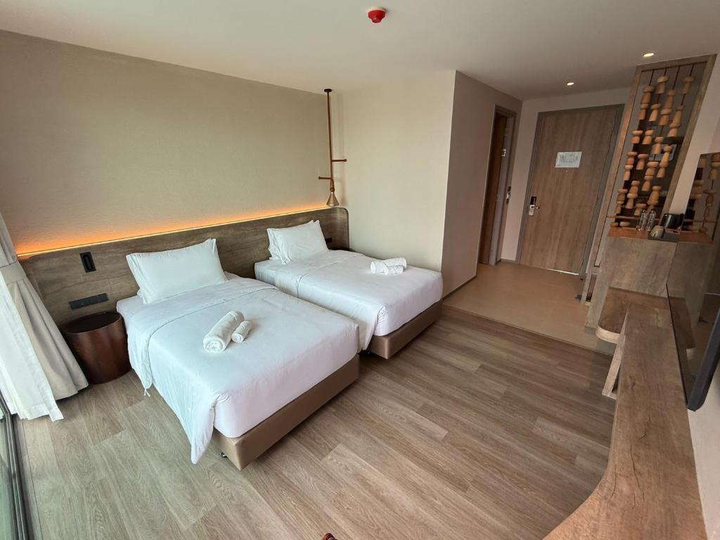 Unya Hotel Ubon - โรงเเรมอัญญาอุบล - Deluxe Tweepersoonskamer Met 2 Aparte Bedden