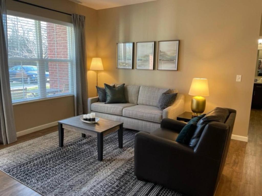 a living room with a couch and a coffee table at The Hilliard Executive No Steps Amazing Beds! in Dublin