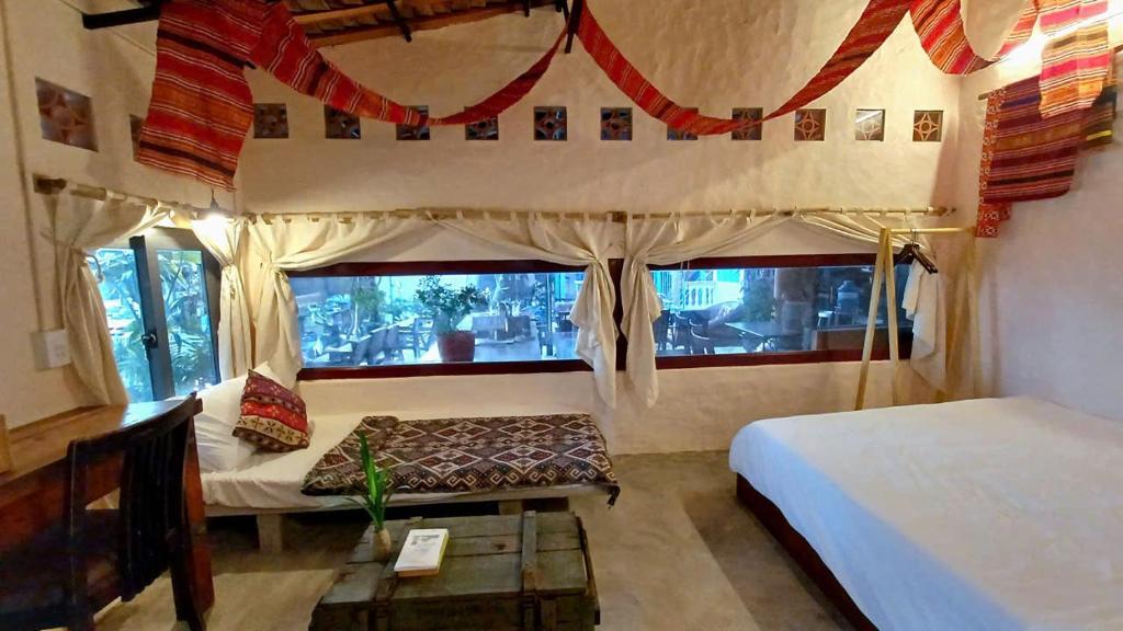 Giường trong phòng chung tại Maidi Homestay Mui Ne