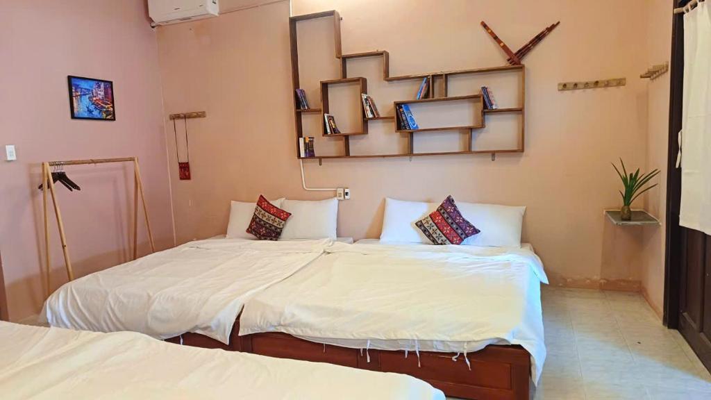Giường trong phòng chung tại Maidi Homestay Mui Ne