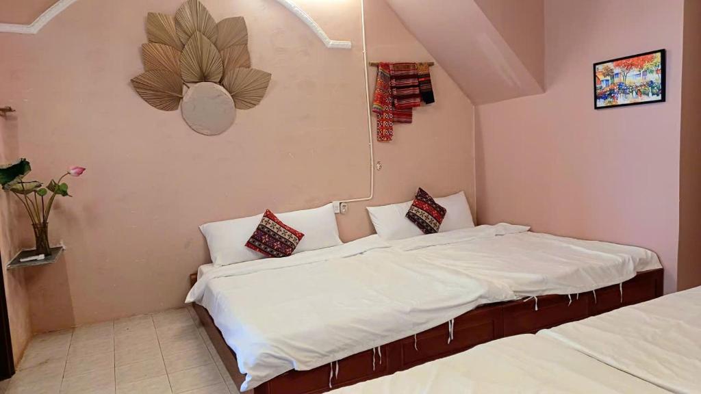 Giường trong phòng chung tại Maidi Homestay Mui Ne