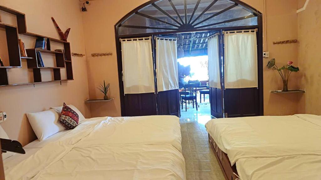 Giường trong phòng chung tại Maidi Homestay Mui Ne