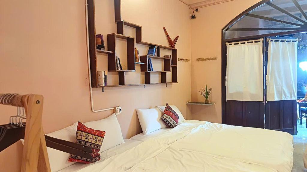 Giường trong phòng chung tại Maidi Homestay Mui Ne