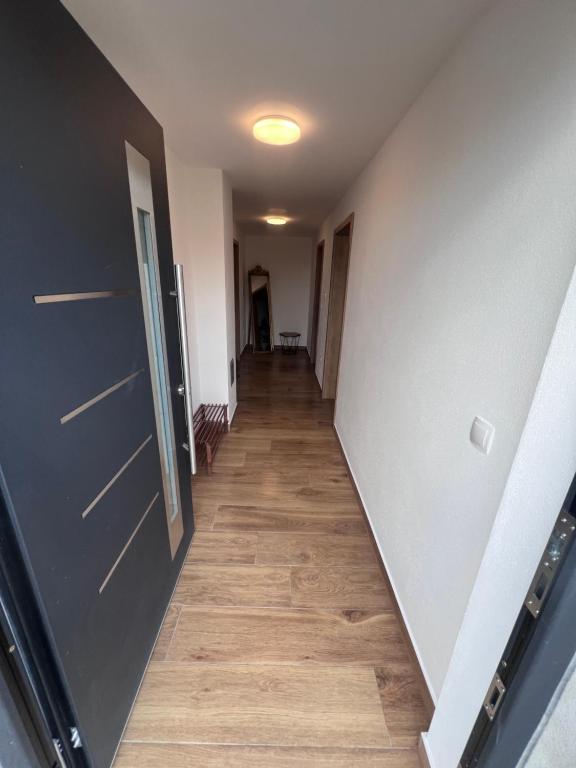 a hallway with a long corridor with wooden floors at Busu in Sulzbach-Rosenberg