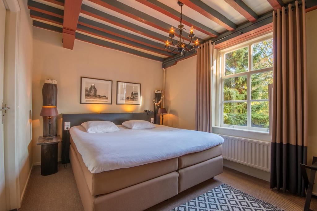 Postel nebo postele na pokoji v ubytování Auberge de Campveerse Toren