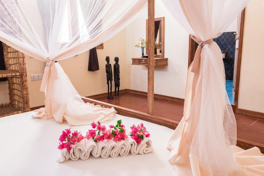 Postel nebo postele na pokoji v ubytování Zan View Hotel