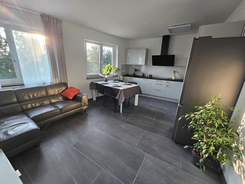 a living room with a couch and a table at Legola in Bubesheim