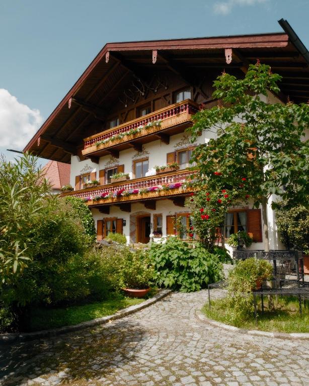 a building with balconies on the side of it at Ferienwohnungen Chiemgau in Rottau