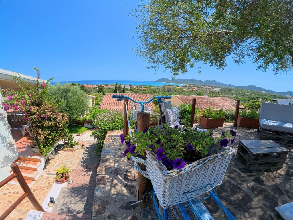a basket of flowers on a patio with a view at Villa Grazia in Santa Lucia