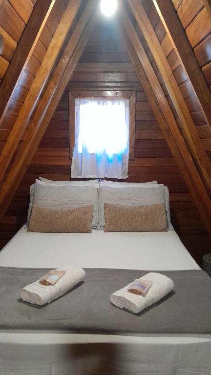 Ένα ή περισσότερα κρεβάτια σε δωμάτιο στο Chalé da Mantiqueira SFX , Pet friendly