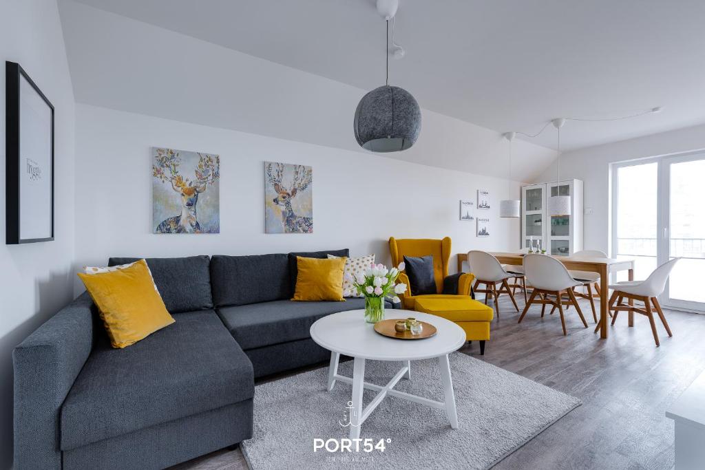 a living room with a couch and a table at Hoppetosse in Olpenitz