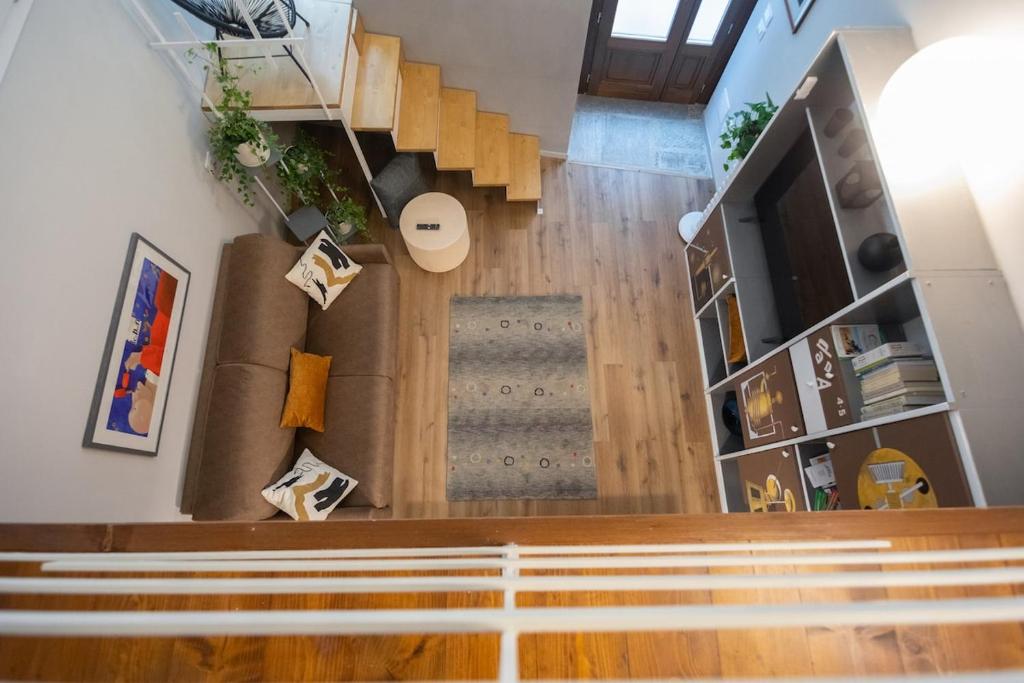 an overhead view of a staircase in a house at Casa degli Specchi- Duplex in city center in Arona