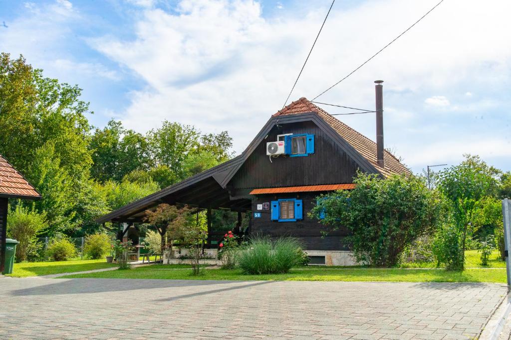a house with a window on the side of it at Rural Holiday House Monto in Gladovec Pokupski