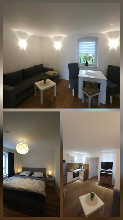 a living room with a couch and a bed and a table at Ferienwohnung Dreblow in Edertal