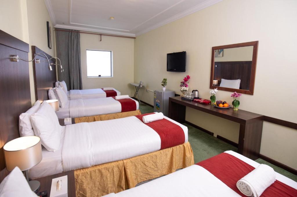 Ένα ή περισσότερα κρεβάτια σε δωμάτιο στο Jadda Al Khalil Hotel
