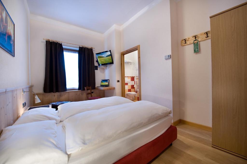 Posteľ alebo postele v izbe v ubytovaní Hotel Alegra
