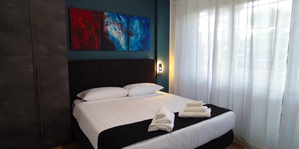 Postel nebo postele na pokoji v ubytování Ancient Rome Colosseum modern and bright apartment