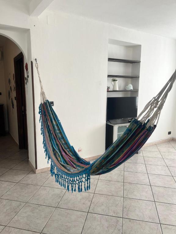 a hammock hanging from a wall in a room at Gina&armando in Cassano Spinola