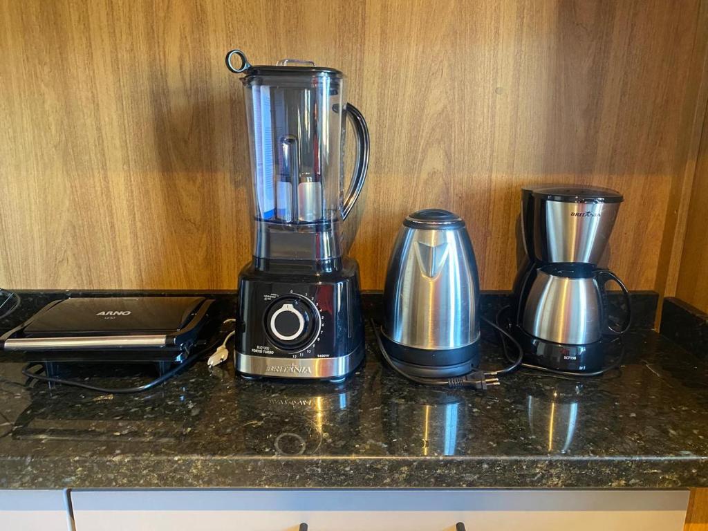 a blender sitting on top of a counter at Apartamento Centro Búzios Luxo in Búzios