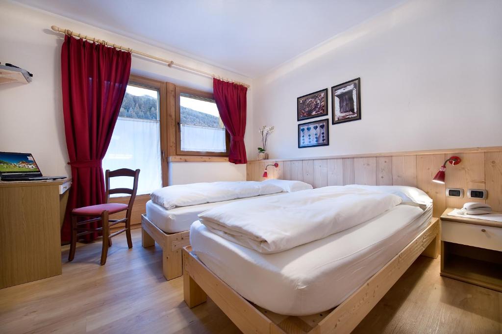 Posteľ alebo postele v izbe v ubytovaní Hotel Alegra