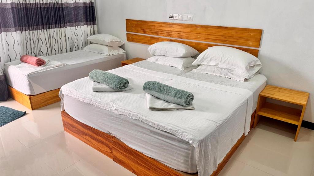 Postel nebo postele na pokoji v ubytování Celeste Thoddoo Maldives