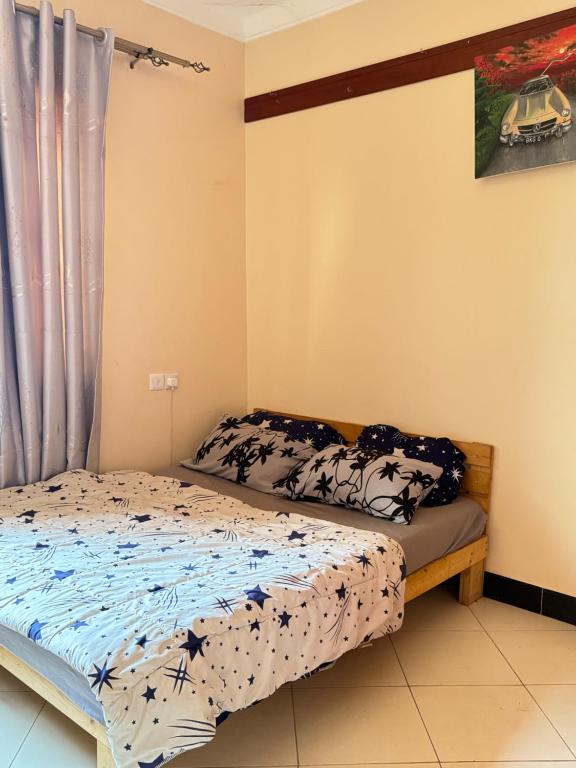 Ένα ή περισσότερα κρεβάτια σε δωμάτιο στο Kimani's Haven