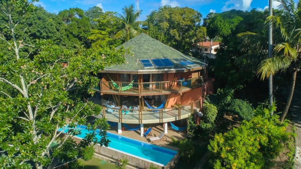 an aerial view of a house with a swimming pool at T Tree Luxury Villa in Pipa