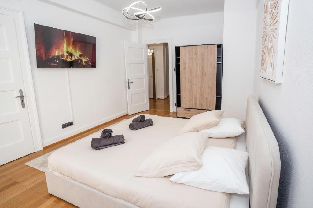 Postel nebo postele na pokoji v ubytování Grand appart cosy - quartier calme