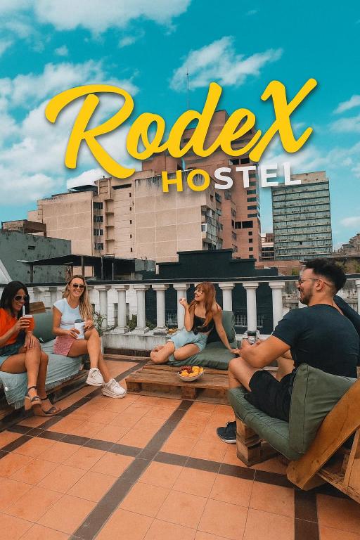 a group of people sitting on the roof of a hotel at Rodex Hostel Tucuman in San Miguel de Tucumán