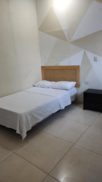 Un pat sau paturi într-o cameră la casa Marez