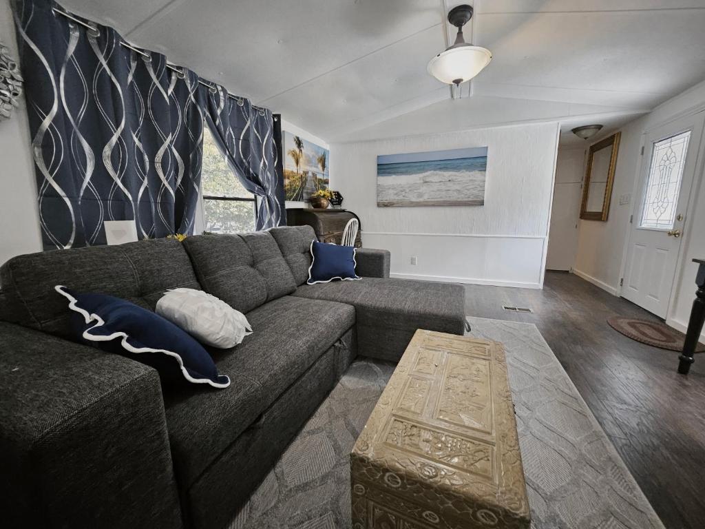 a living room with a couch and a table at Imma Place in Trenton
