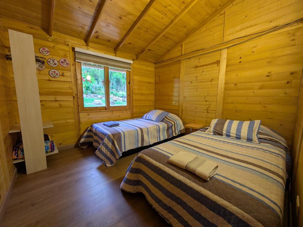 Postel nebo postele na pokoji v ubytování Cabaña Caracolí. Tranquilidad vía a la laguna